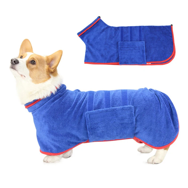 Dog wearing a blue towel coat with red trim on a white background