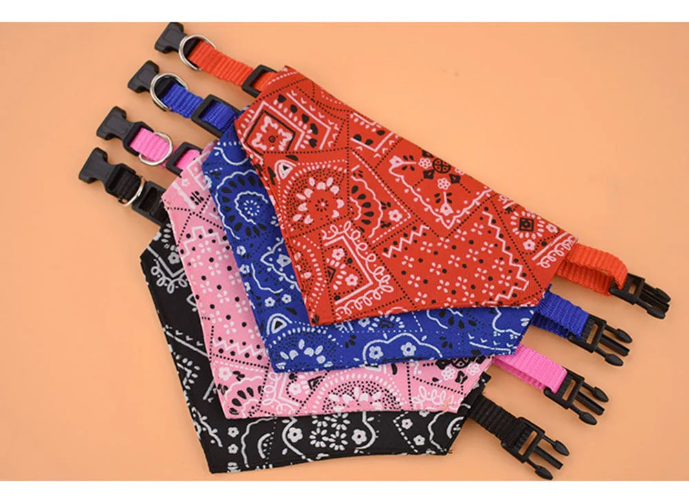 Set of colorful bandana dog collars on a beige background