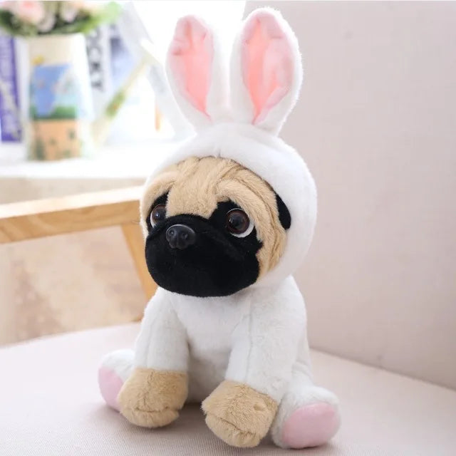 Stuffed animal plush toy with a pug face and bunny ears on a light background