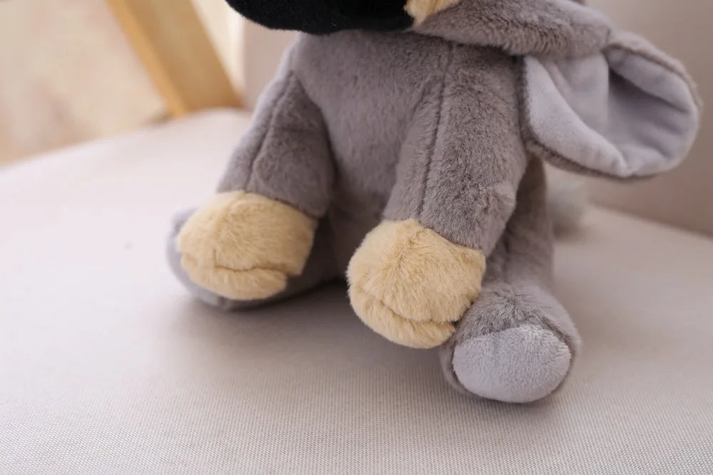 Plush gray pug toy on a light surface