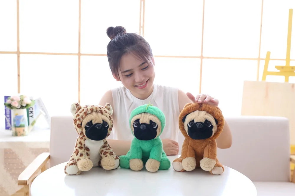Woman sitting on a couch with three plush toys resembling dogs in front of her.