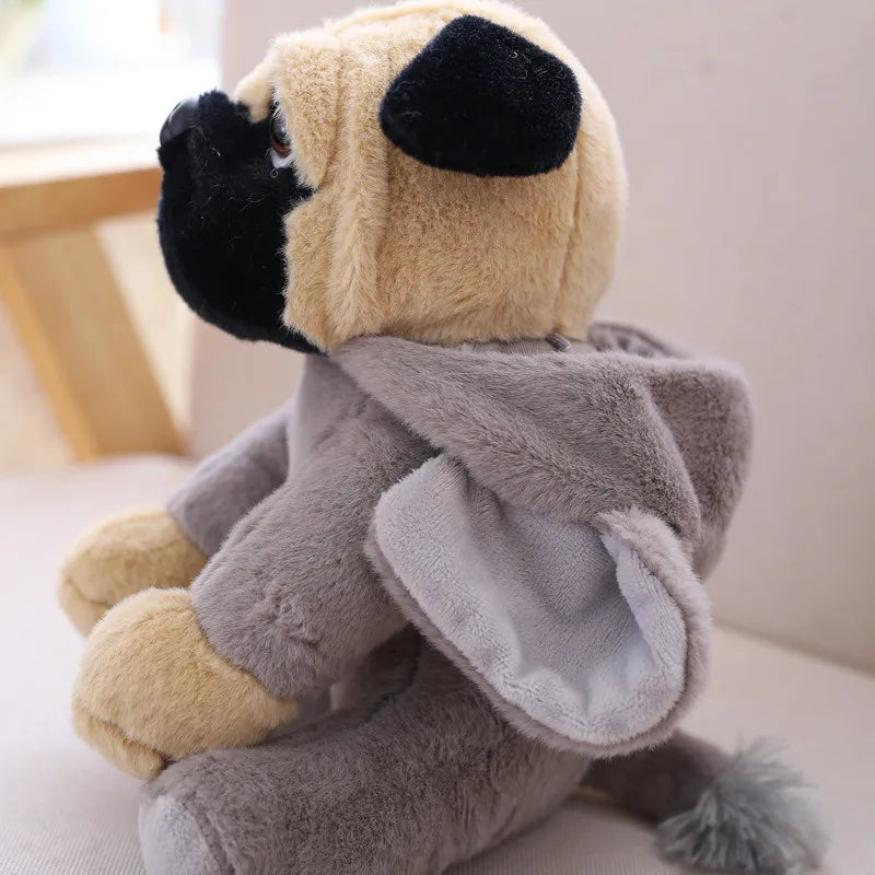 Plush sloth toy sitting on a light surface with a neutral background