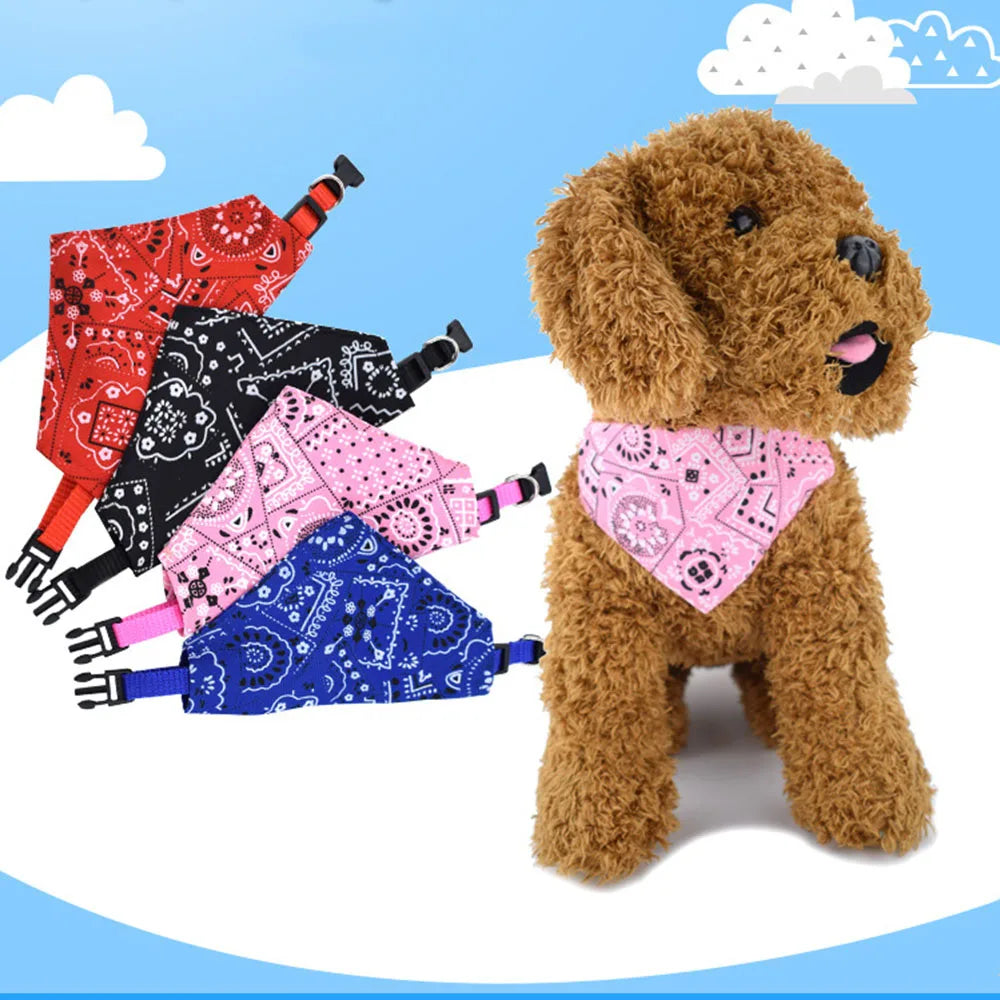 stuffed toy dog wearing a pink bandana with colorful bandanas on a blue and white cloud background