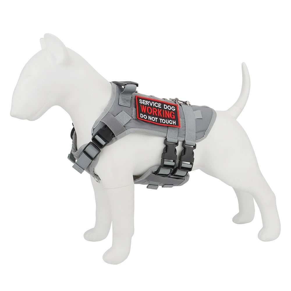 Gray service dog harness with a red and black label on a white background