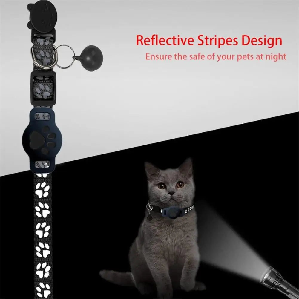 Cat wearing a reflective pet collar with paw print design on a black and white background.