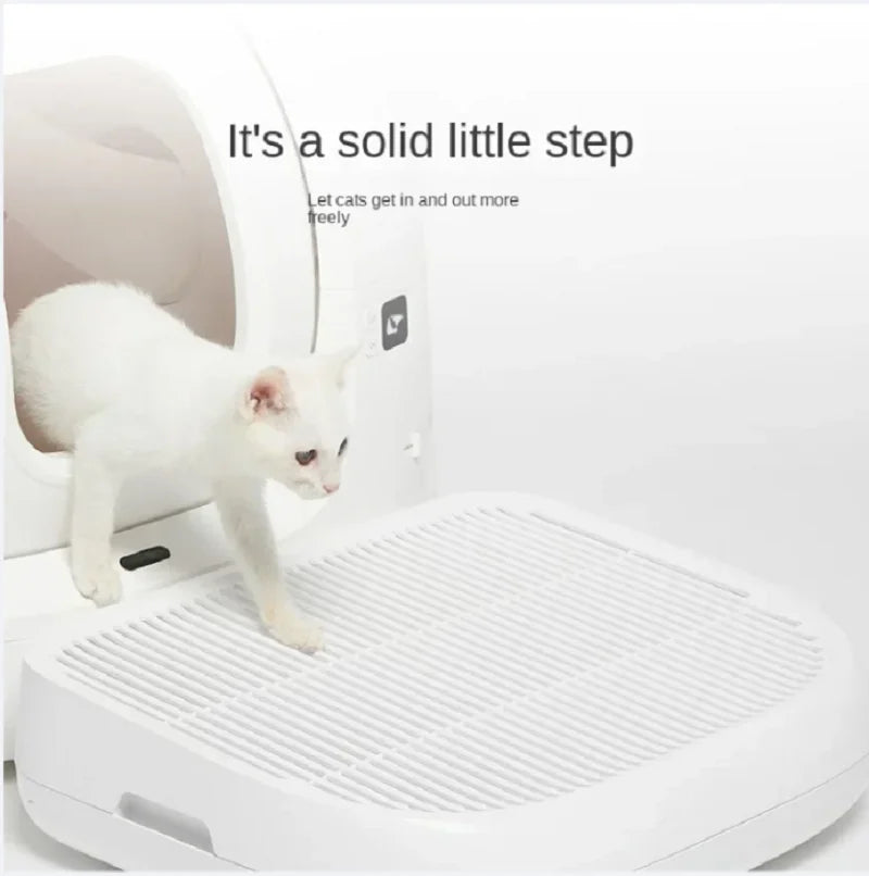 White cat stepping onto a white pet ramp with text 'It's a solid little step' on a light gray background.