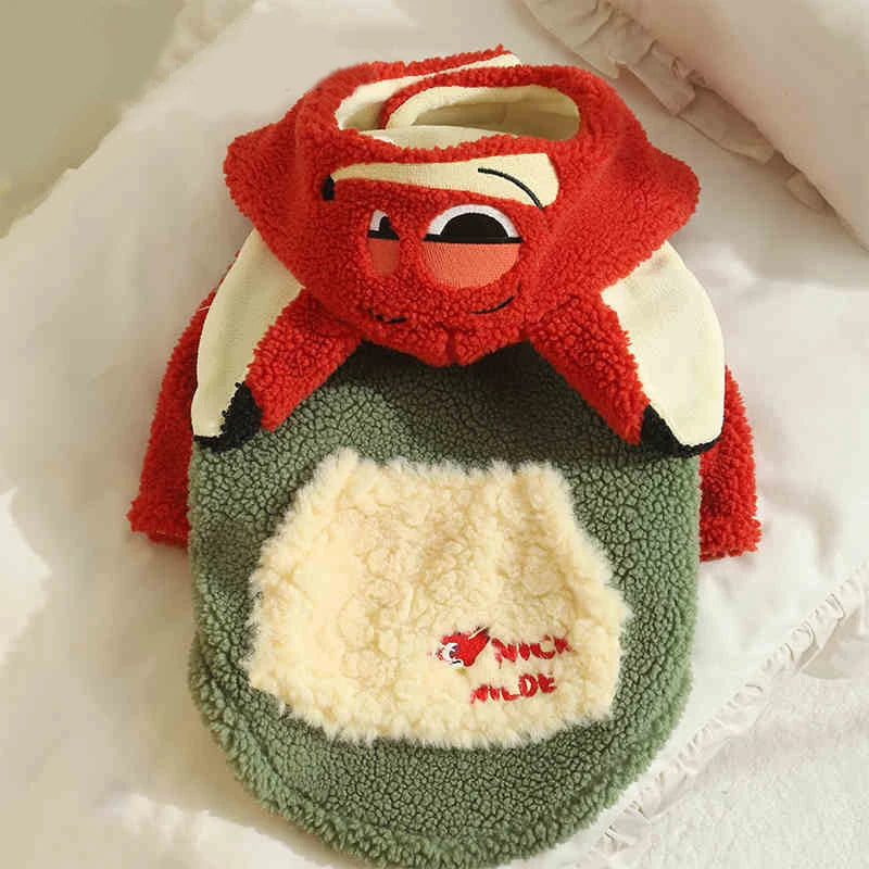 Plush toy resembling a cartoon character with red hair and green body on a white background