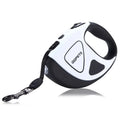Retractable dog leash with black and white design on a white background