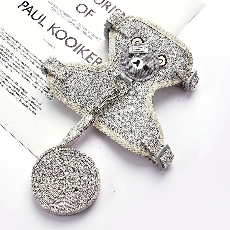 Dog muzzle and leash set on a white surface with text in the background