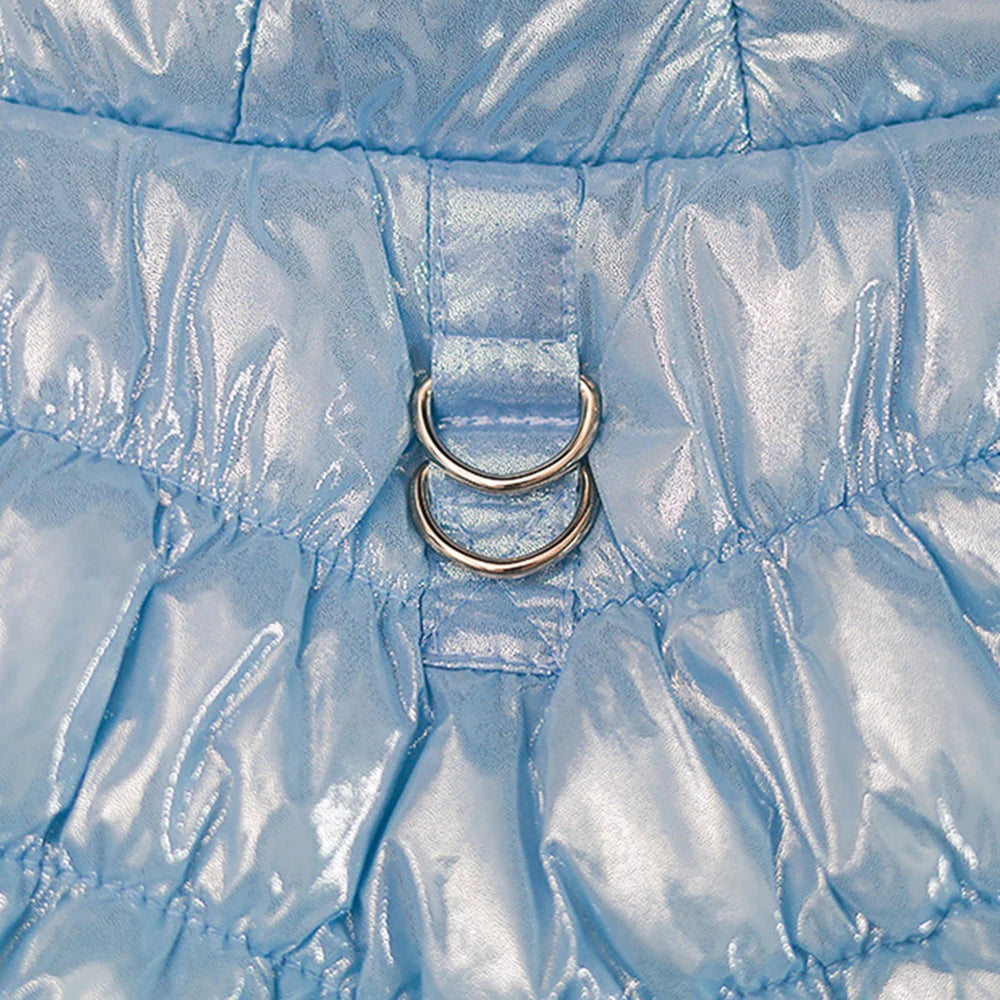 close-up of blue fabric with two rings stitched into it