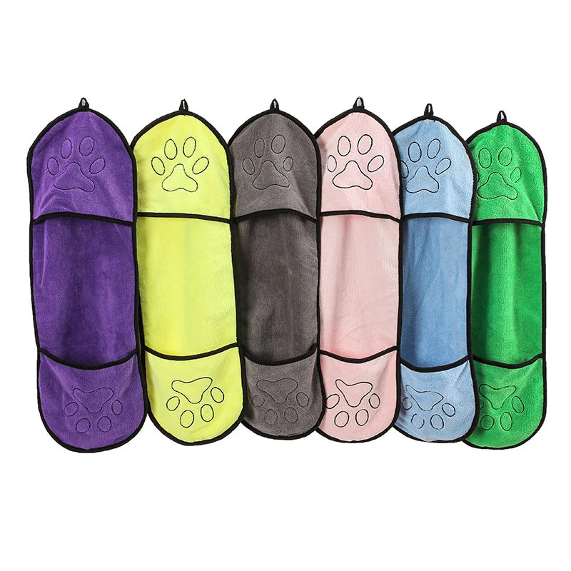 Set of six colorful pet towels with paw prints on a white background