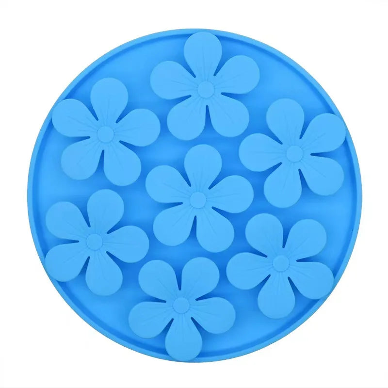 Blue silicone mold with flower shapes on a white background