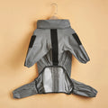 Gray raincoat with black accents on a beige background