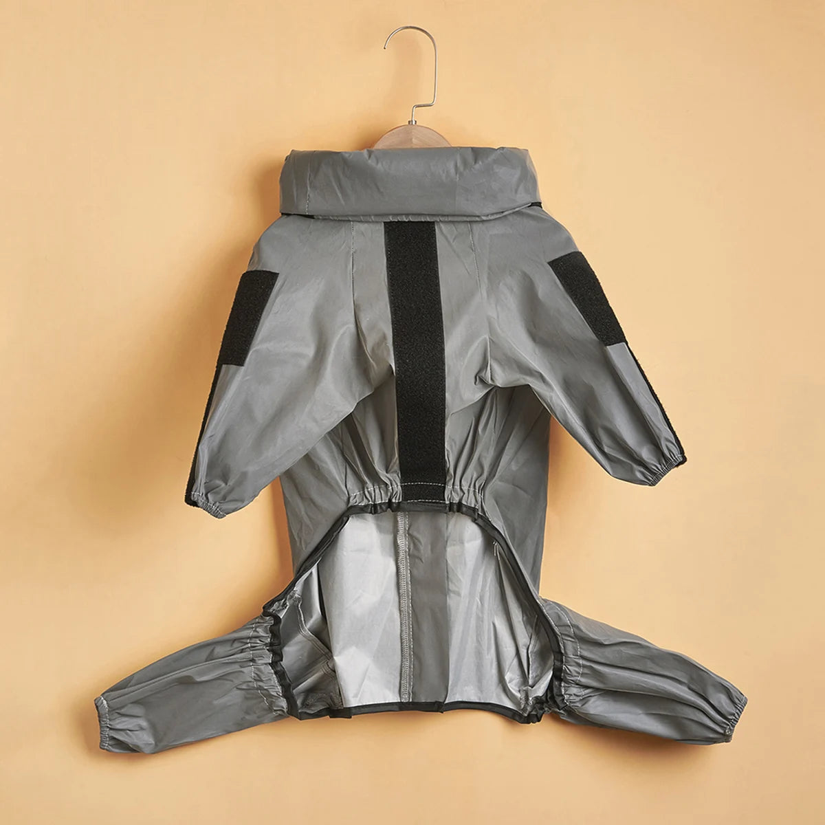 Gray raincoat with black accents on a beige background