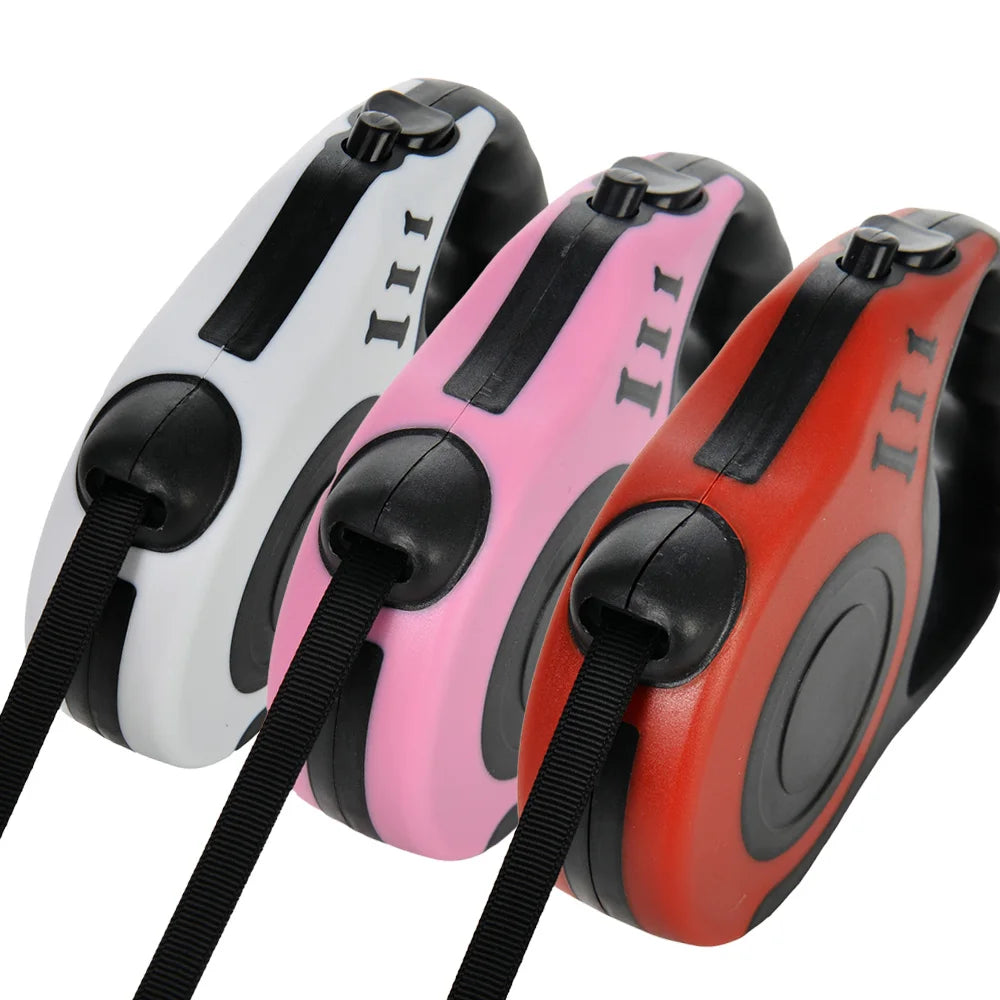Three leashes in white, pink, and red on a white background
