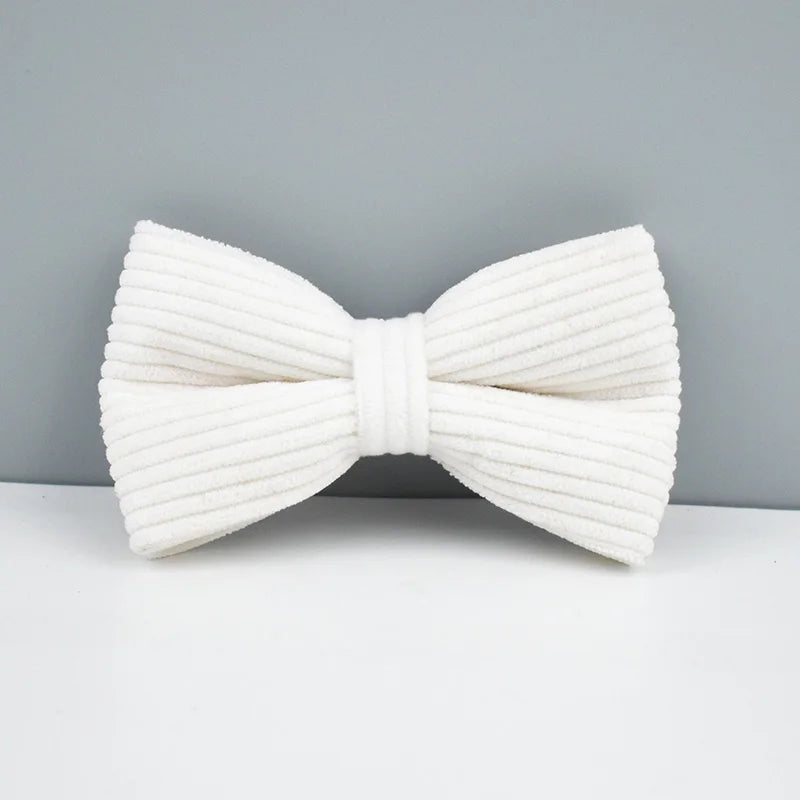 White bow tie on a gray background