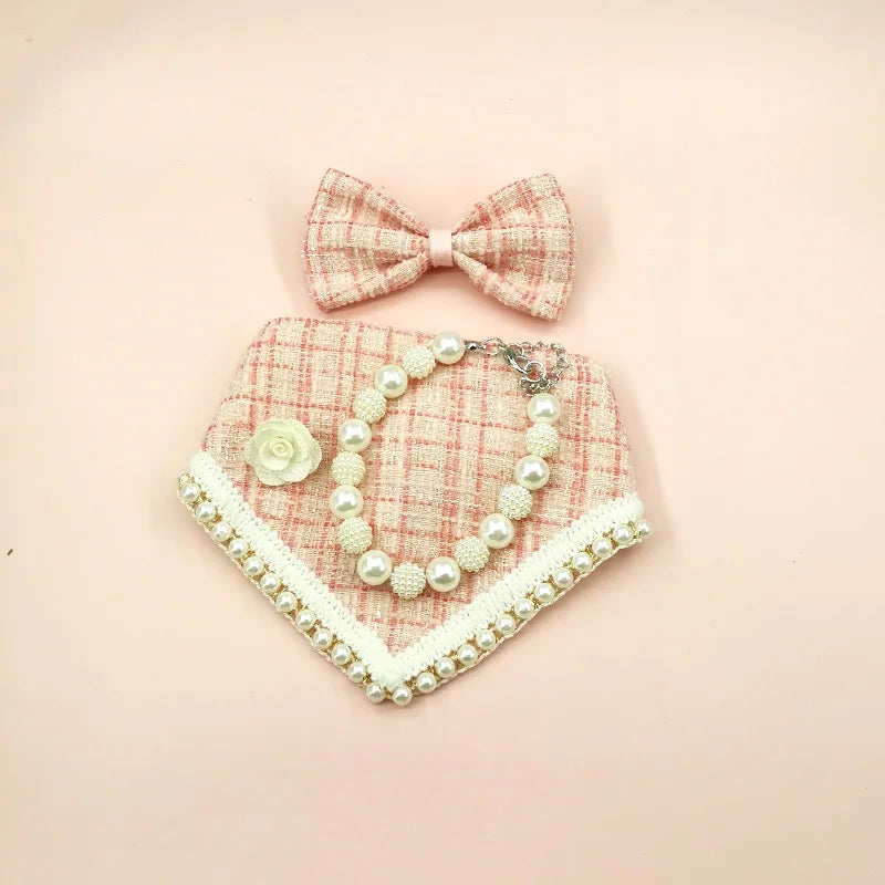Dog bandana with pearl details and matching bow on a pink background
