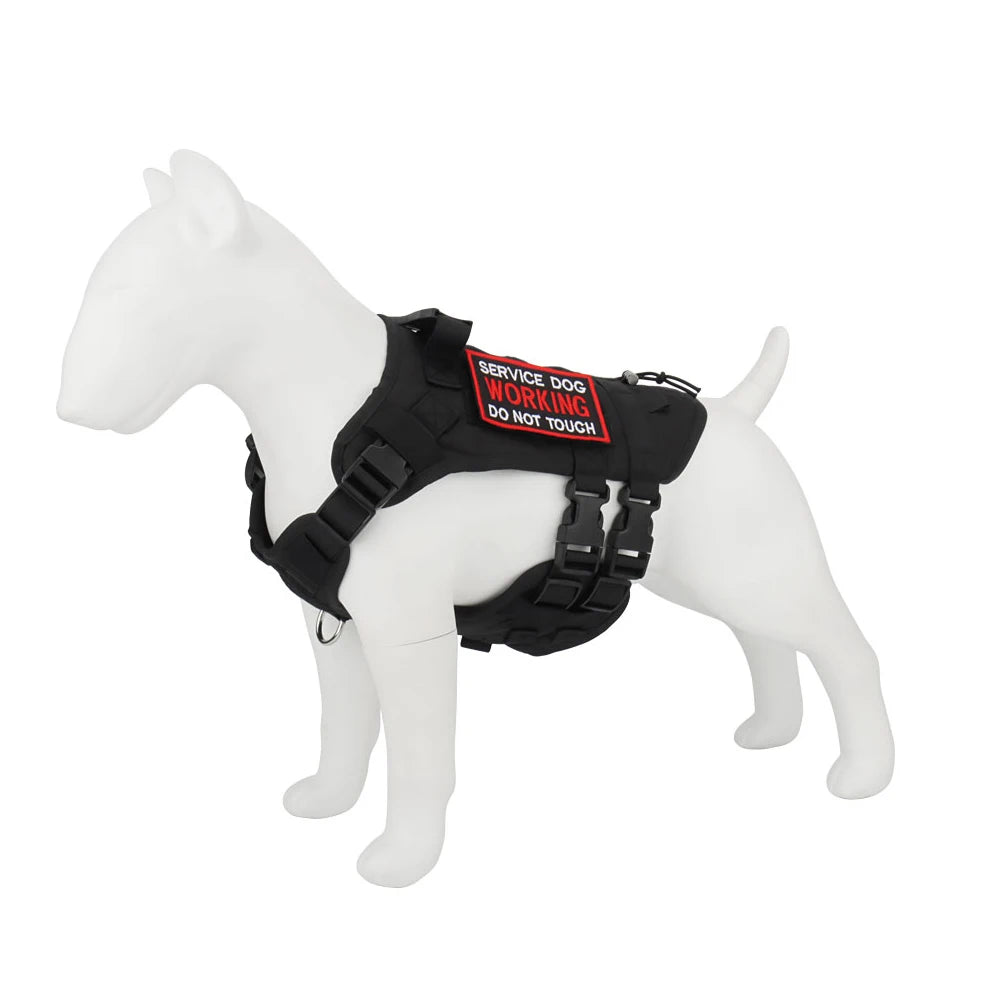 Black service dog harness with red label on a white background
