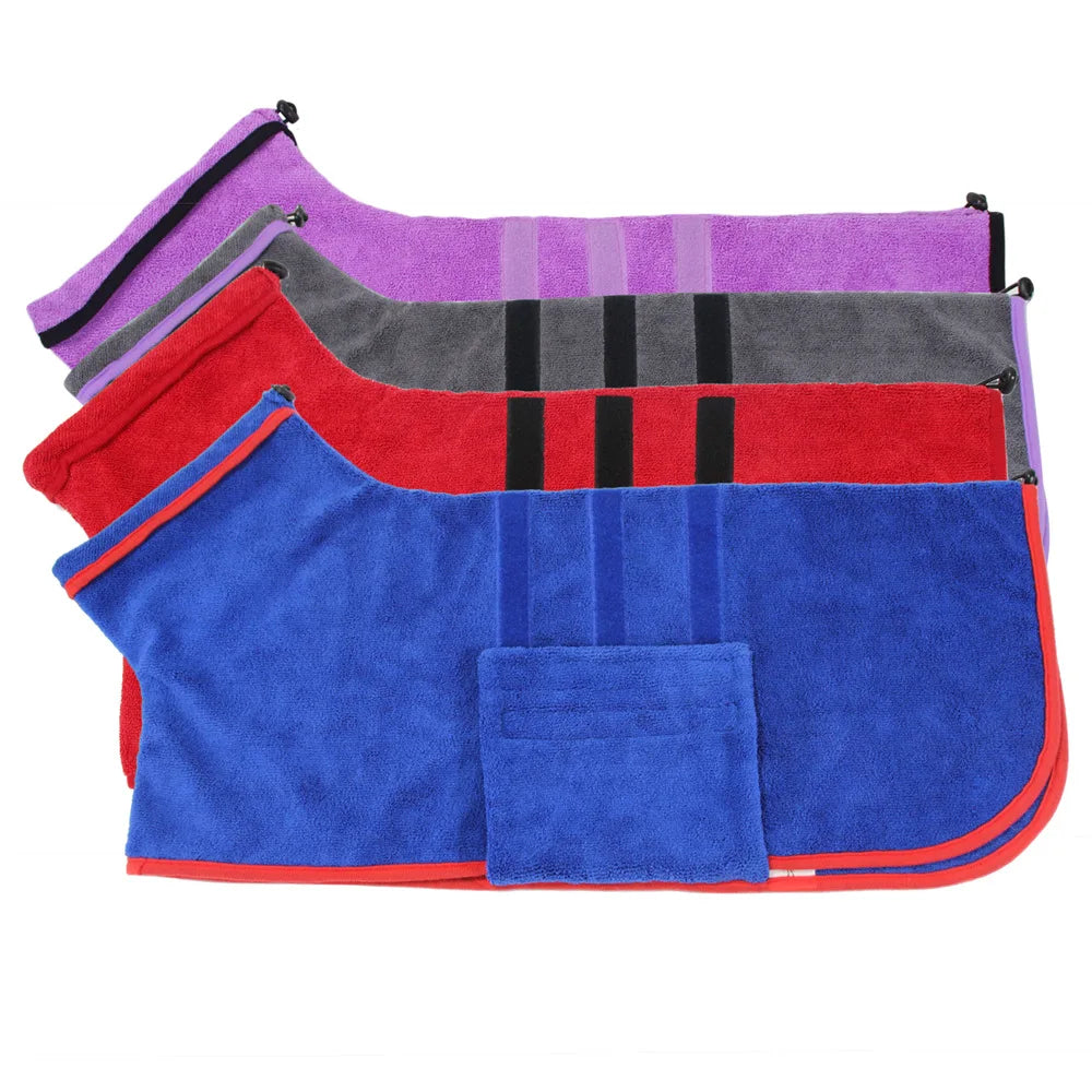 Stack of colorful saddle pads on a white background