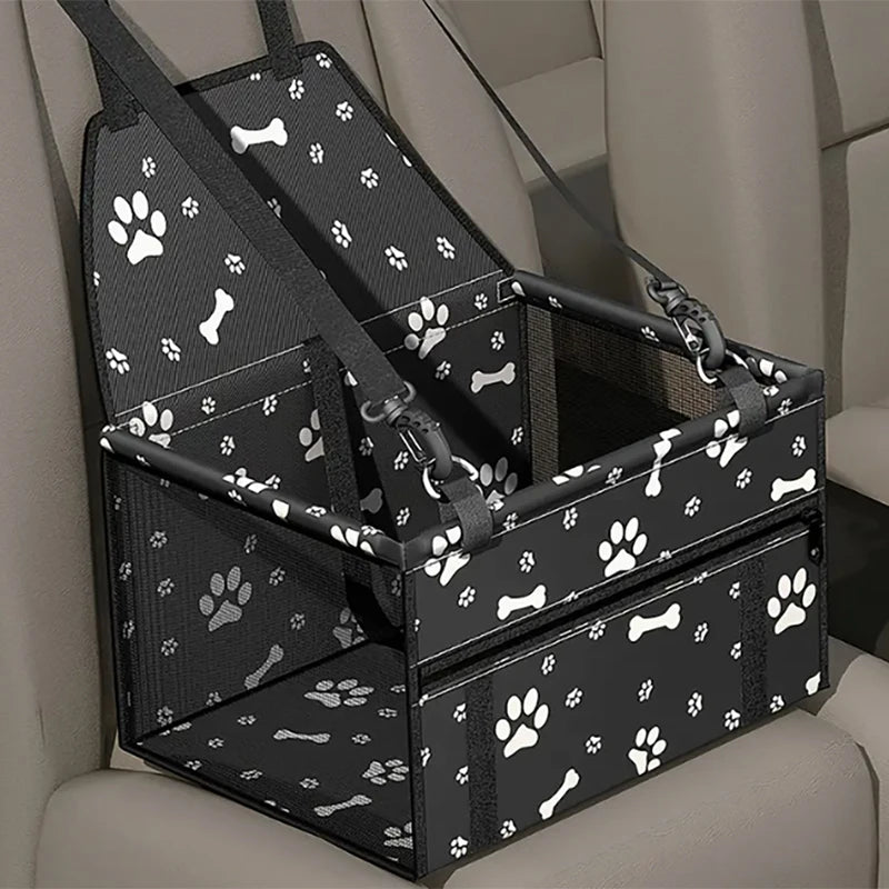 Pet car seat with paw and bone pattern on a car seat