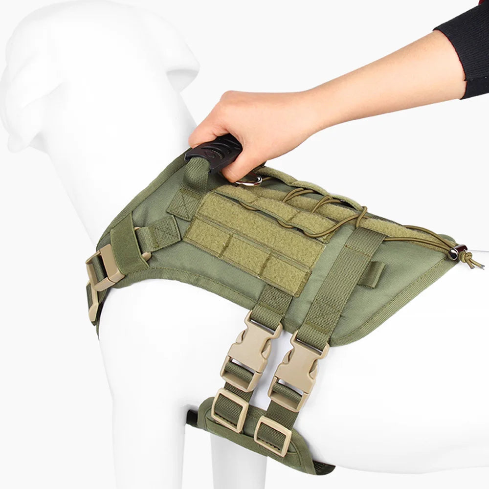 Green tactical dog vest held by a person on a white background