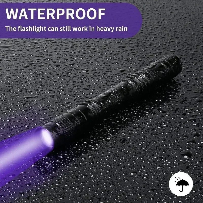 Purple flashlight on a wet surface with 'WATERPROOF' text above it.