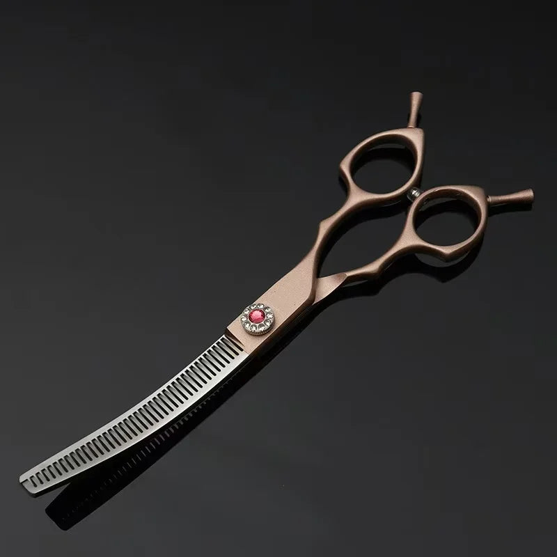 Hair cutting scissors with a rose gold handle on a black background