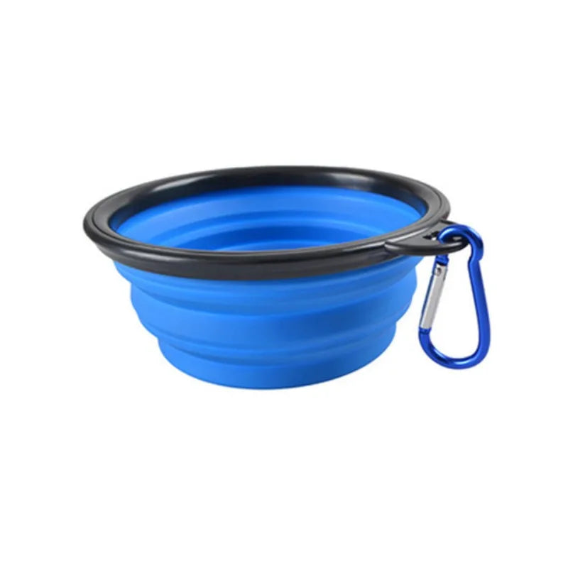Blue collapsible dog bowl with a carabiner on a white background