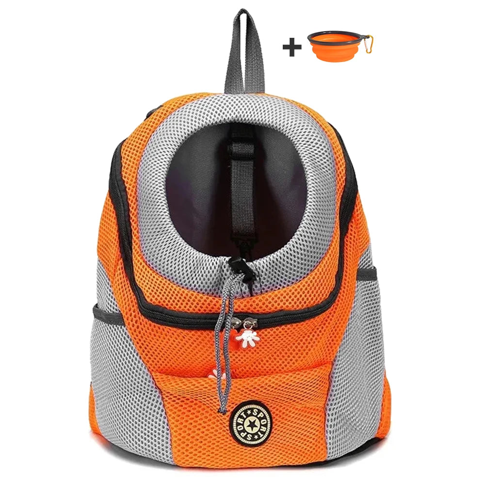 Orange and gray pet carrier with a small orange bowl on a white background