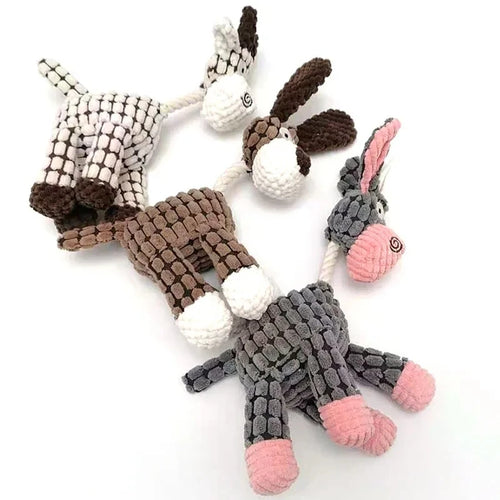 Set of knitted animal toys including a dog, donkey, and goat on a white background