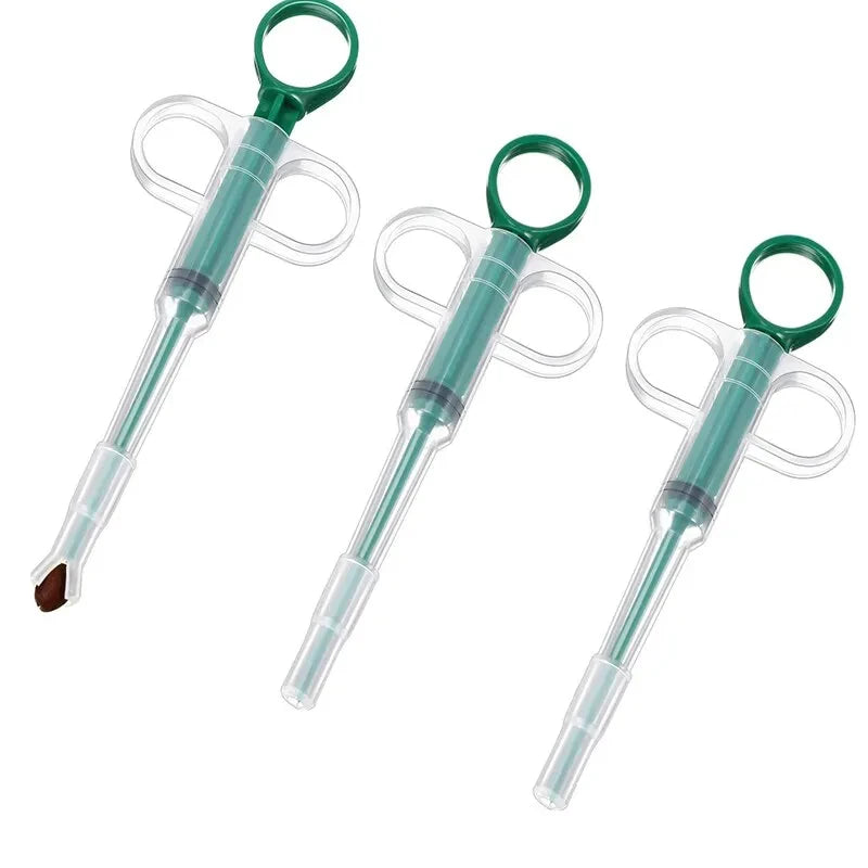 3 green and clear pill dispensing tool with green handles on a white back round  