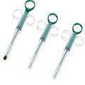 3 green and clear pill dispensing tool with green handles on a white back round  