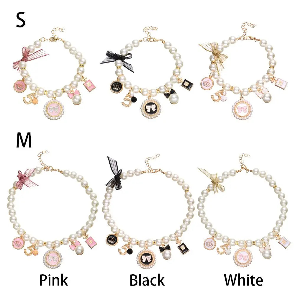 Set of pearl bracelets with various charms in pink, black, and white on a white background.