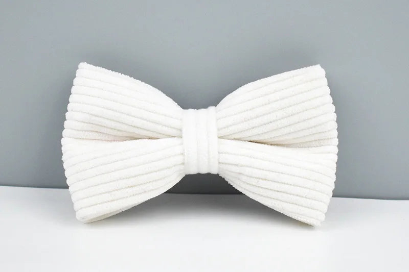 White bow tie on a gray background