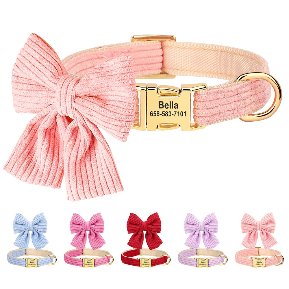 Pink dog collar with a large bow and gold buckle, featuring a engraved name and phone number on a white background.