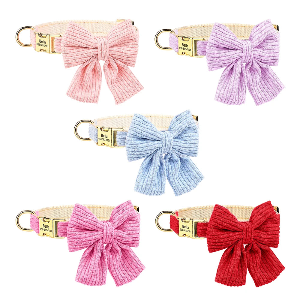 Set of five dog collars with large bows in pink, purple, blue, and red on a white background.