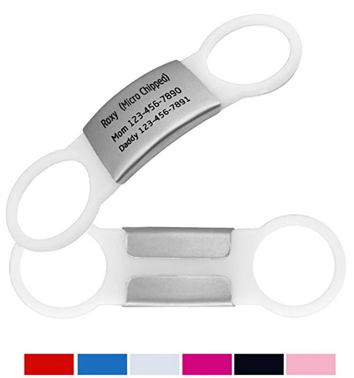 White and silver medical scissors with engraved text on a white background