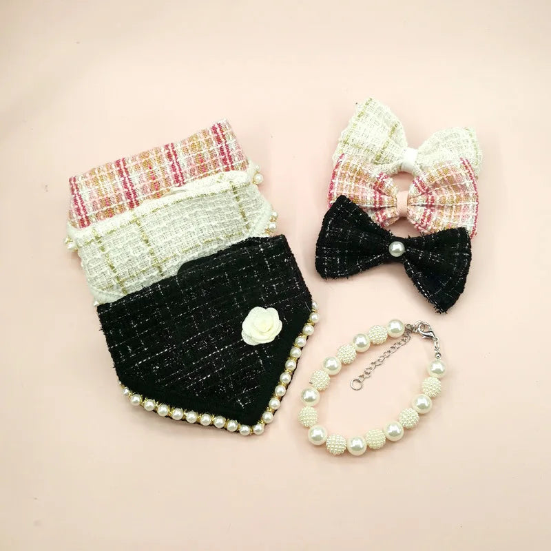 Small accessories with plaid top, black base, pearl embellishments, and a matching bow on a pink background.