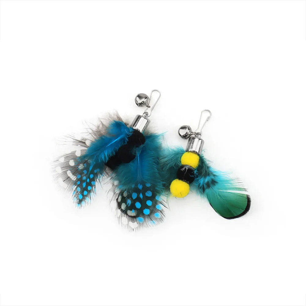 Pair of earrings with blue feathers and yellow beads on a white background