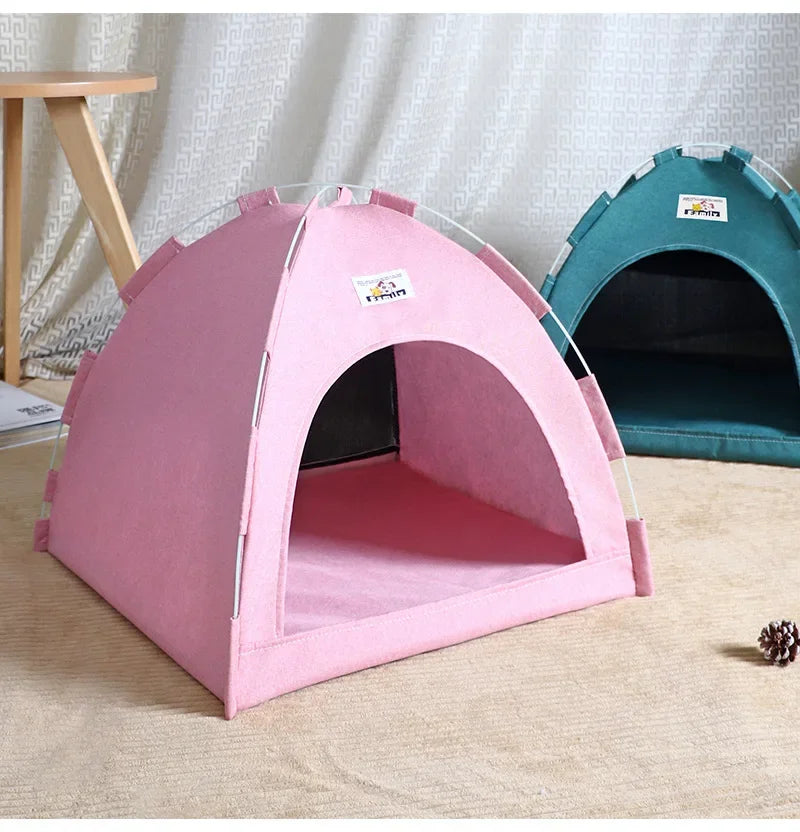 Pink and green pet tent with a white curtain behind