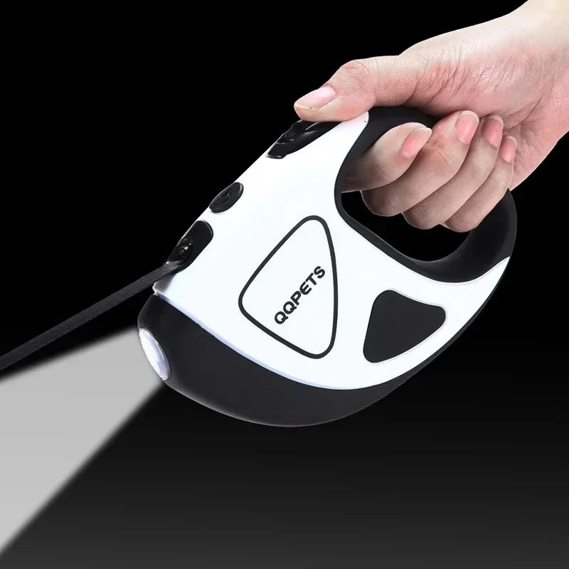 Hand holding a white and black electronic device with 'QQPETS' branding on a black background