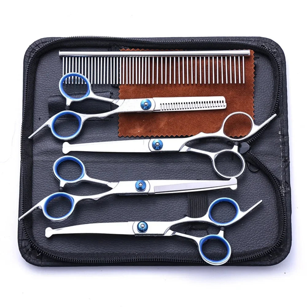 Set of scissors and a comb in a black case on a white background