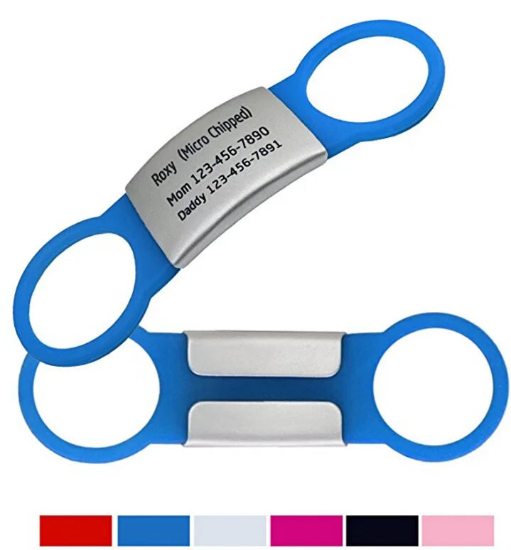 Blue and silver pet grooming shears with engraved text on a white background