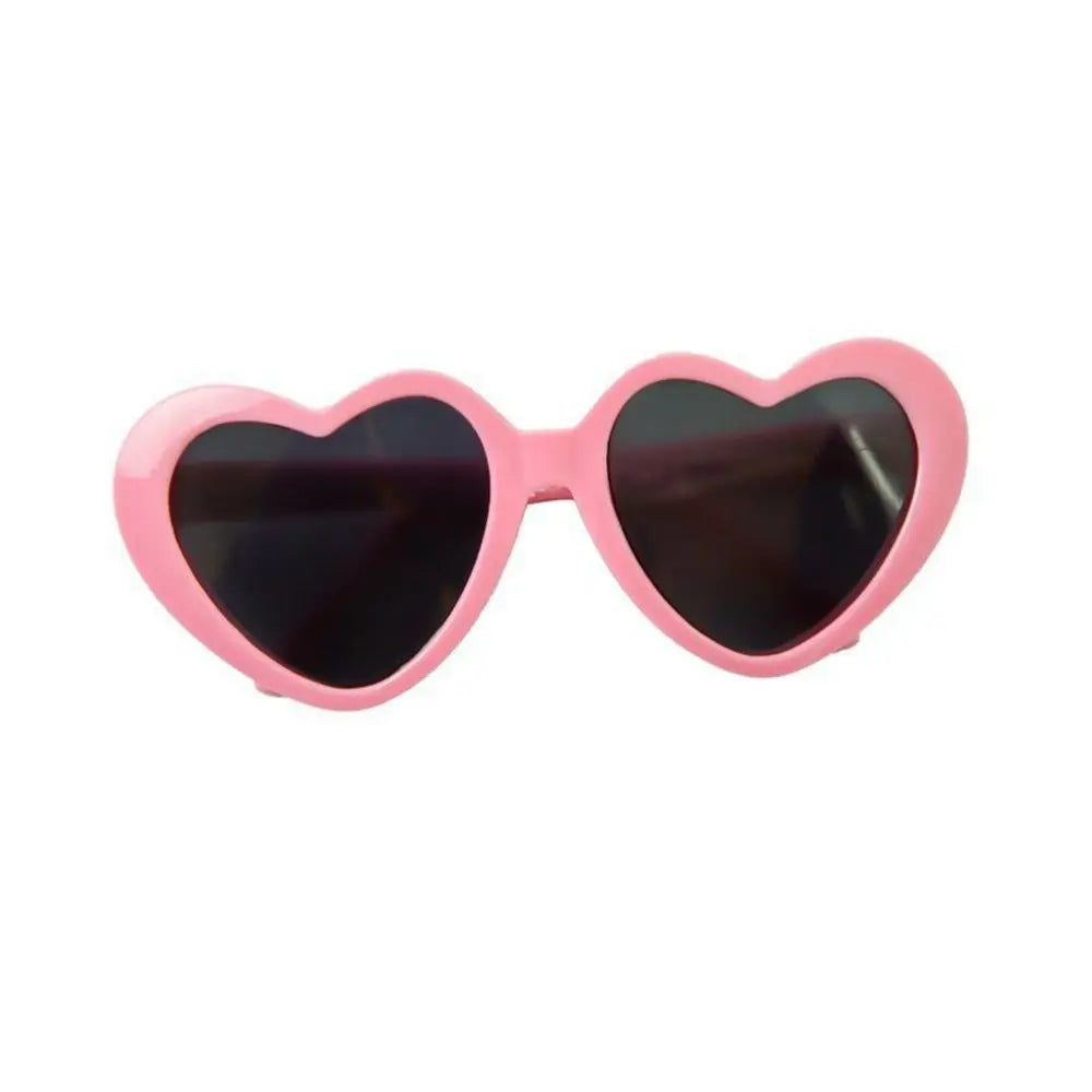 Heart-shaped pink sunglasses on a white background