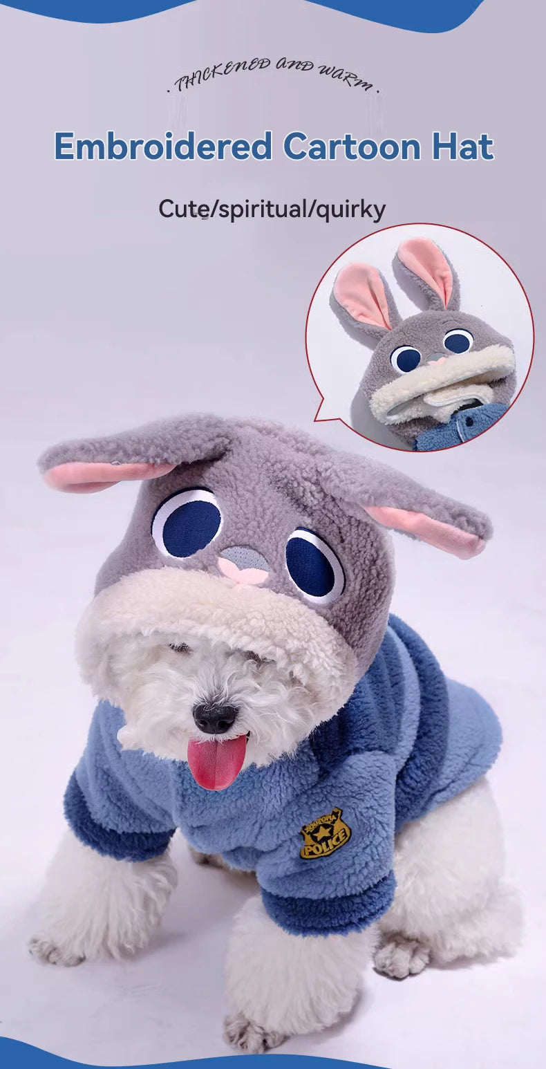 Dog wearing a cartoon donkey costume with embroidered details on a light gray background.