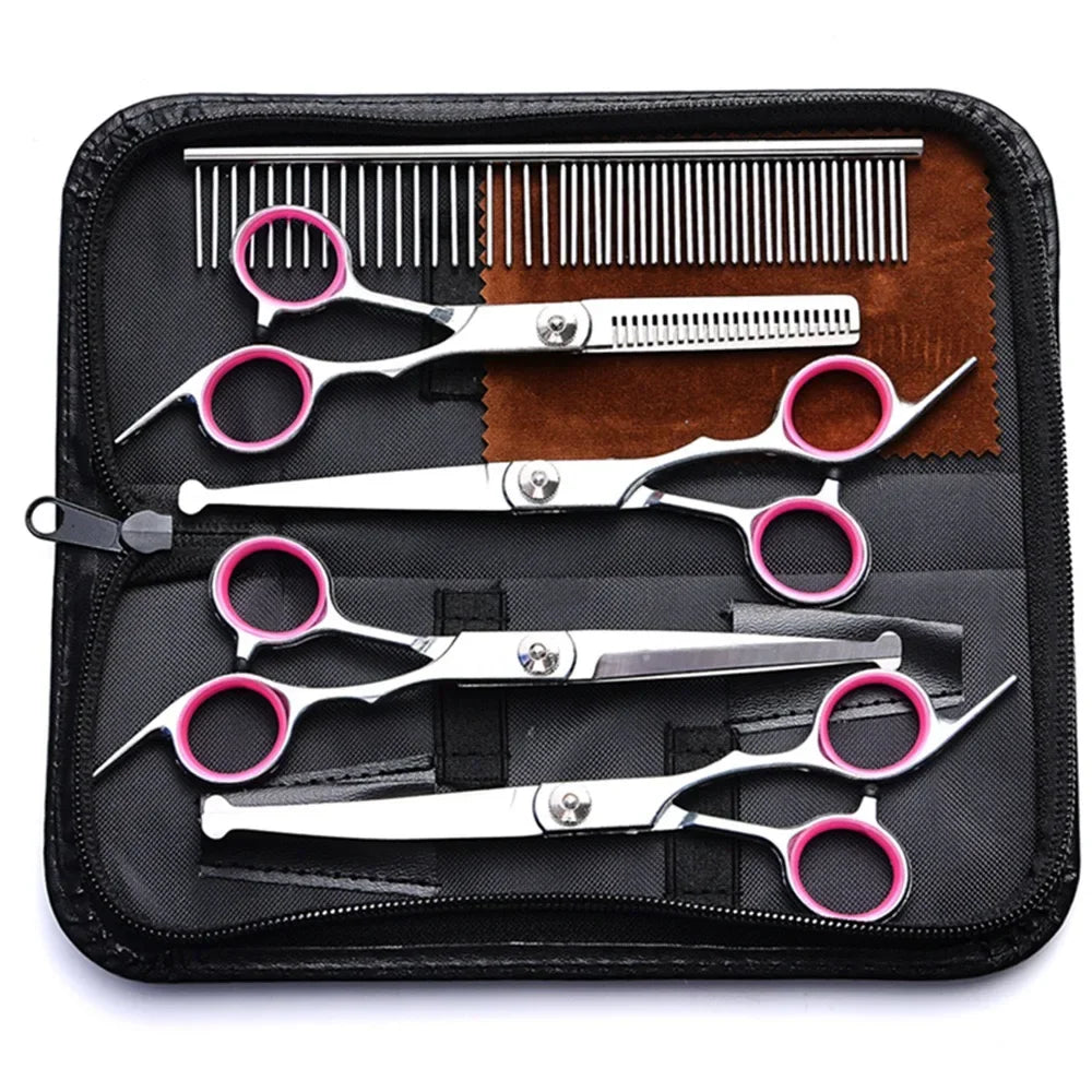 Set of scissors and combs in a black case on a white background