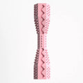 Pink pet toy with textured design on a white background