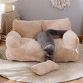 Beige pet bed with a gray cat on a wooden floor.