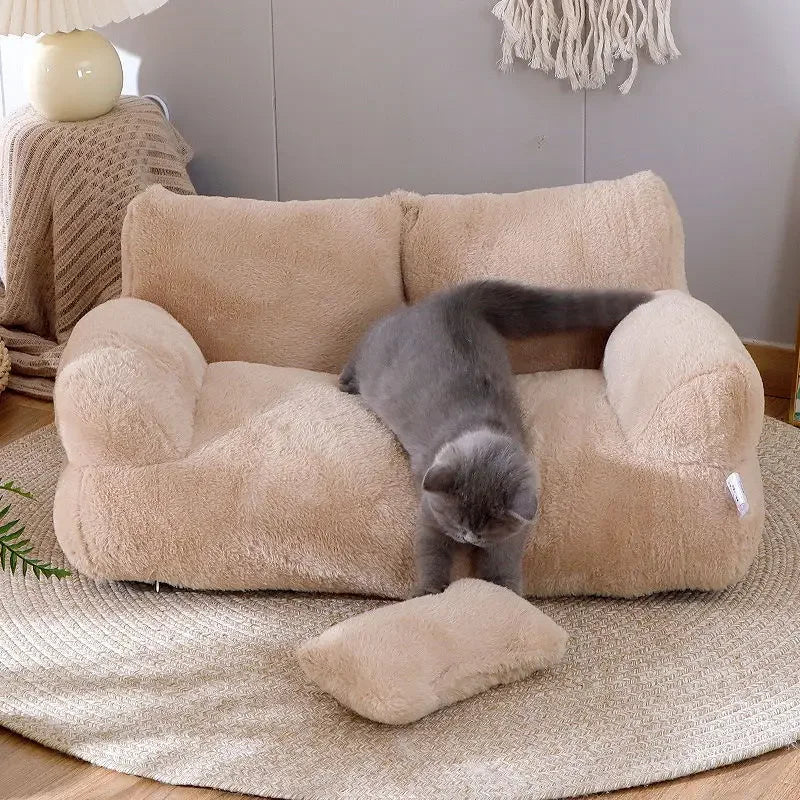 Beige pet bed with a gray cat on a wooden floor.