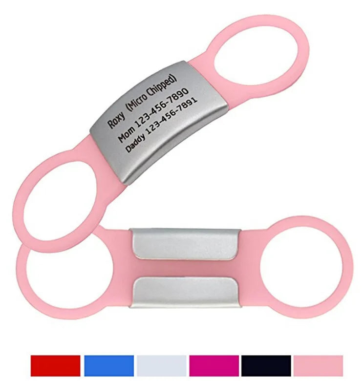 Pink pet scissors with engraved metal labels on a white background